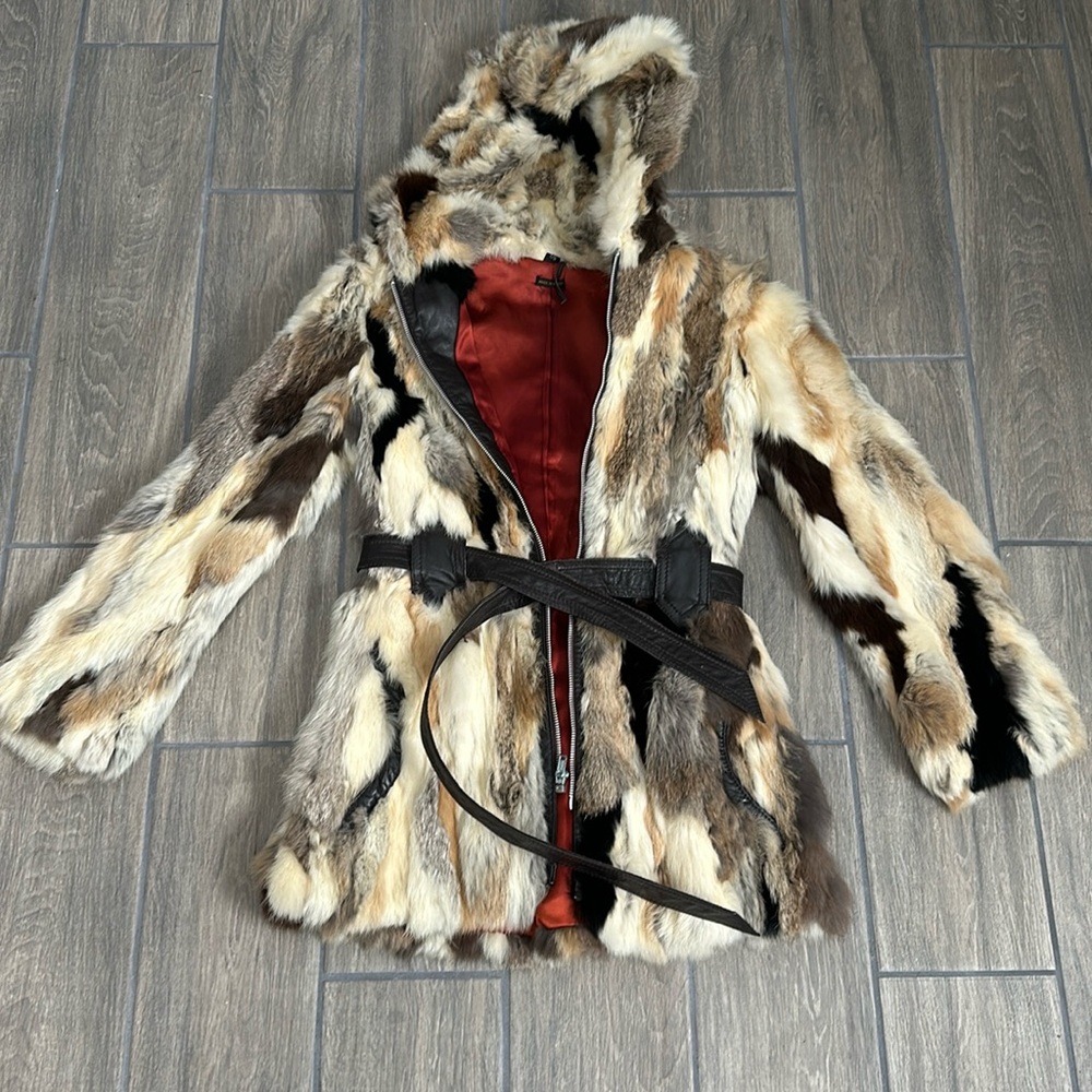 Rabbit fur coat, patchwork style. Leather belt and leather zip front. Pockets